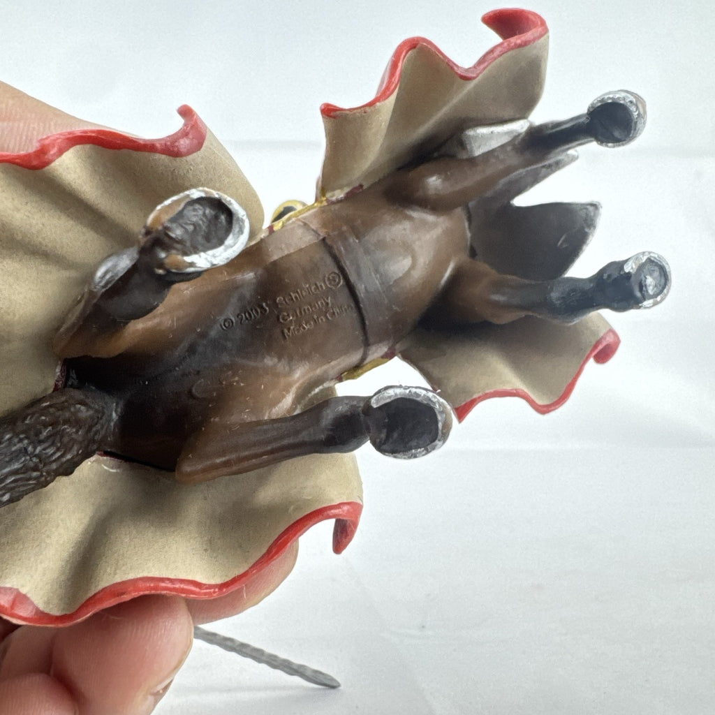 Papo red horned knight holding sword mounted on a Schleich crimson fleur-de-lis barded war horse