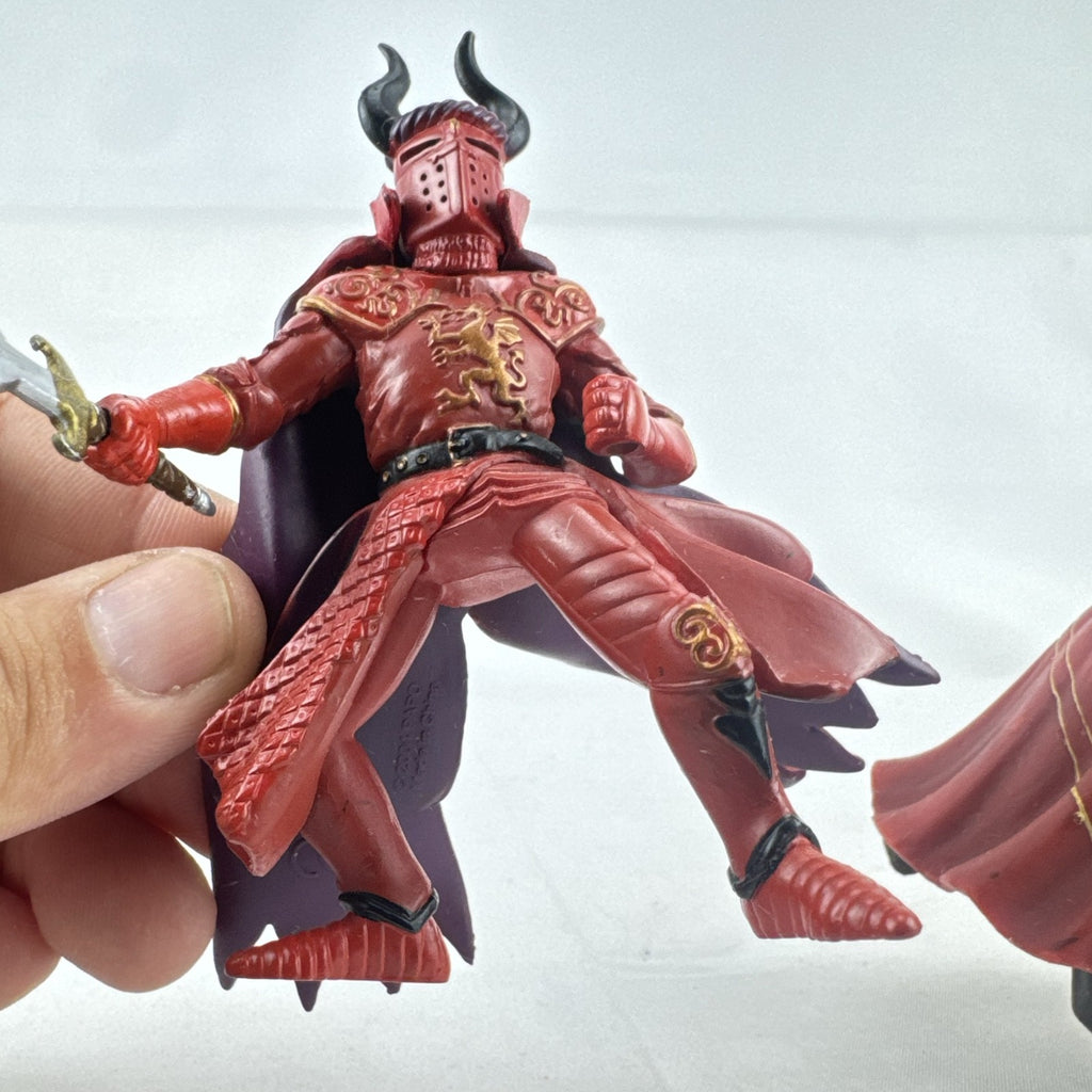 Papo red horned knight holding sword mounted on a Schleich crimson fleur-de-lis barded war horse