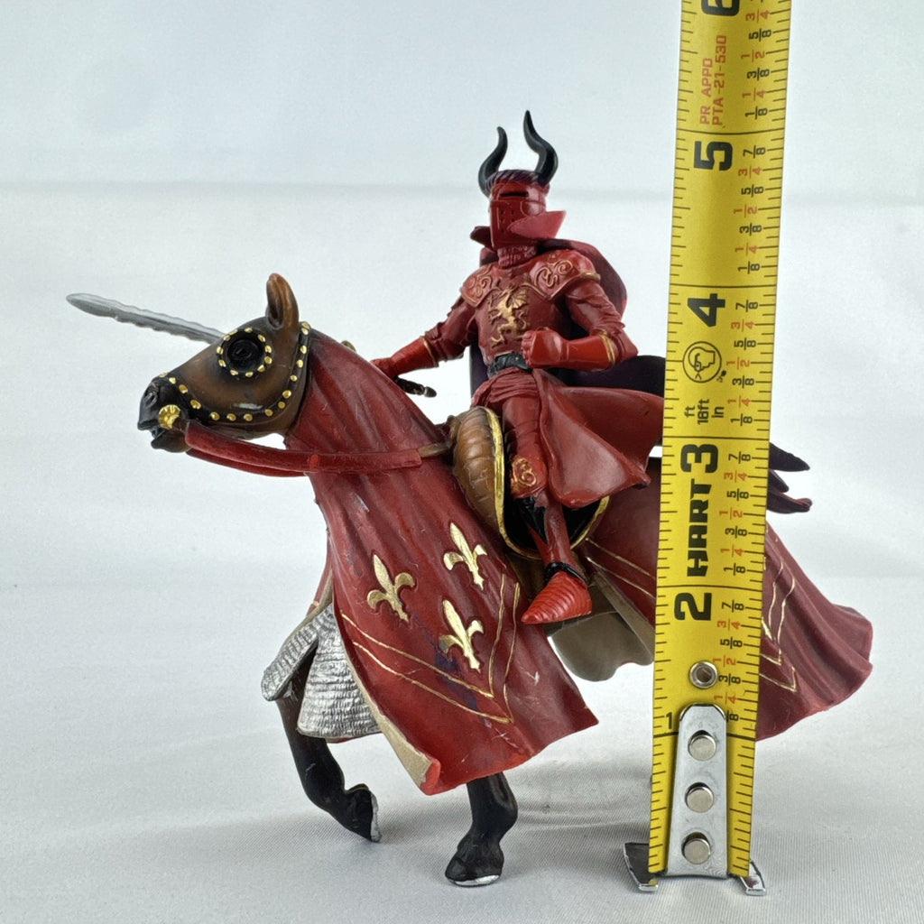 Papo red horned knight holding sword mounted on a Schleich crimson fleur-de-lis barded war horse