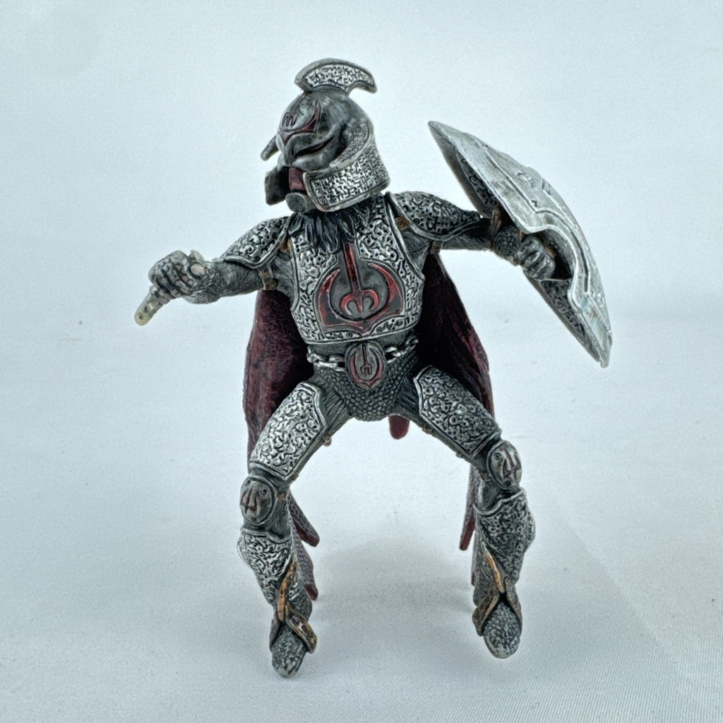 Schleich Eldrador Dragon Knight Rider action figure in plate armor with red cape and shield