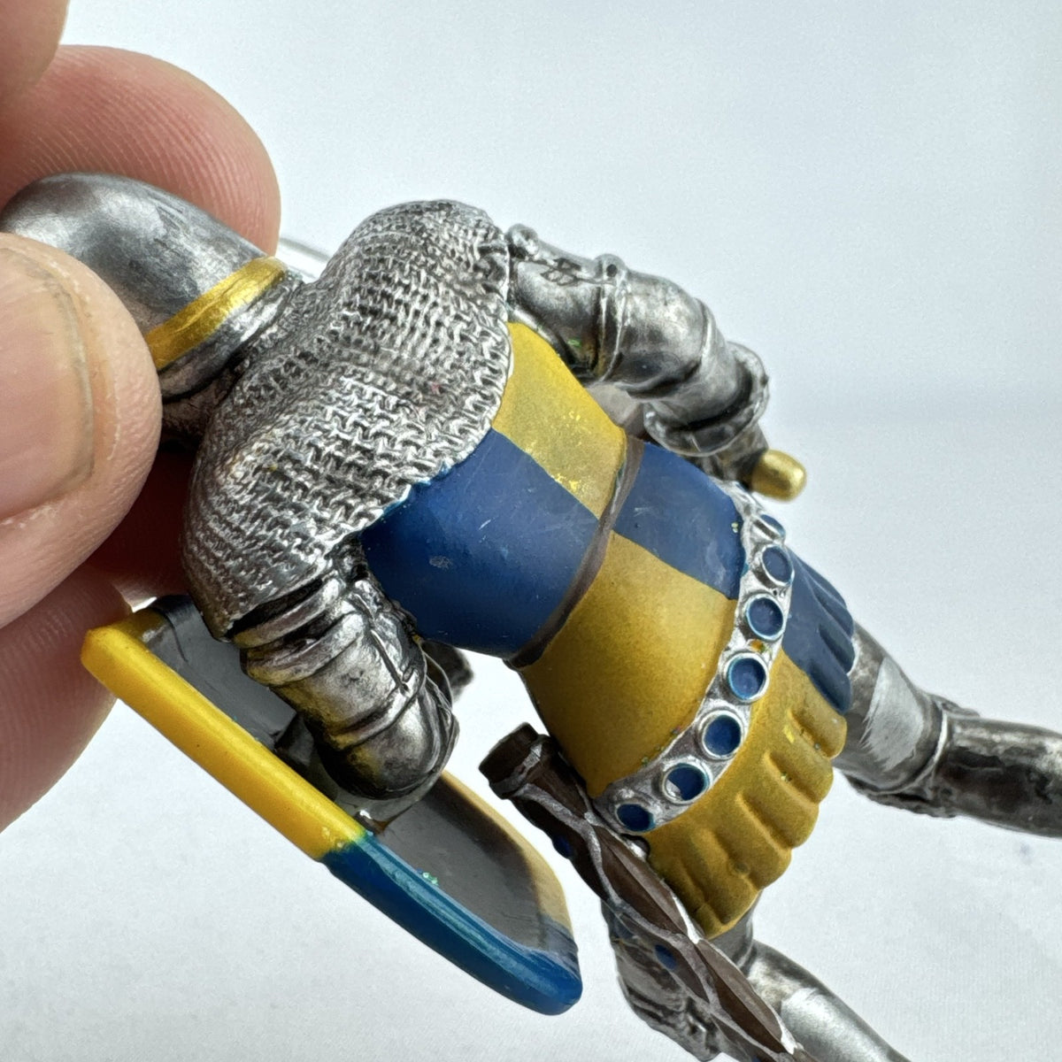 Schleich 2003 medieval knight foot soldier plastic figure holding a sword and blue and yellow lion shield