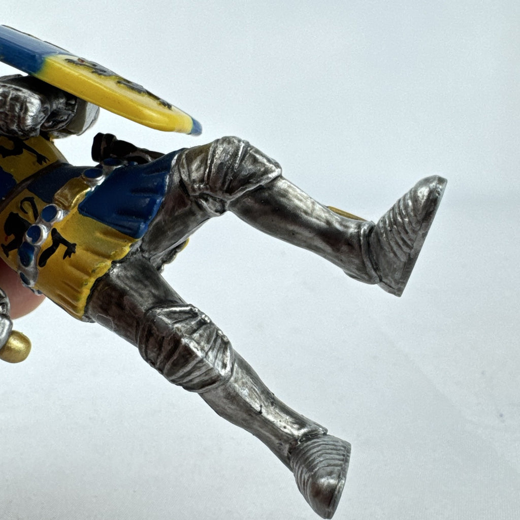 Schleich 2003 medieval knight foot soldier plastic figure holding a sword and blue and yellow lion shield
