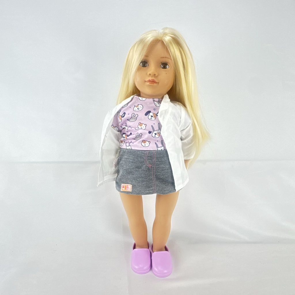 Our Generation Nicola 18-inch blonde veterinarian doll in white lab coat, patterned top, and purple shoes
