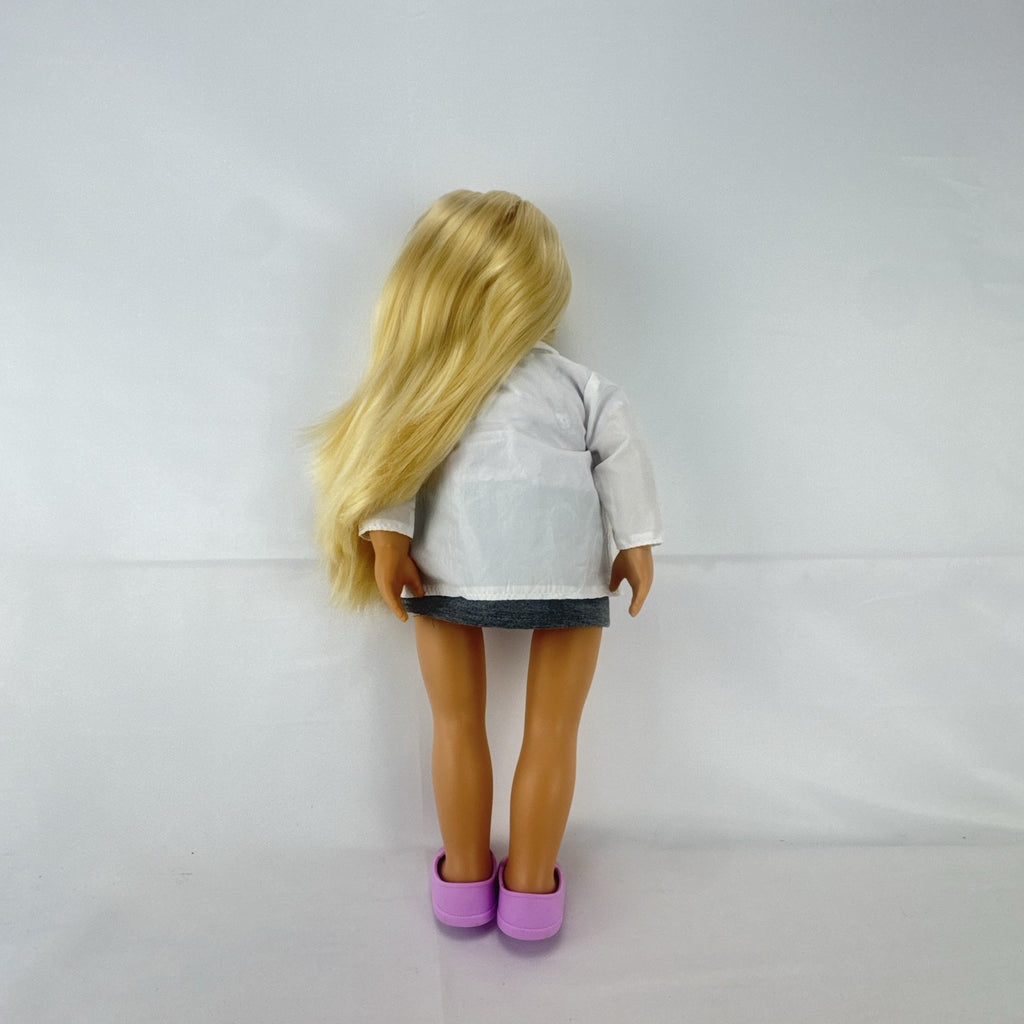 Our Generation Nicola 18-inch blonde veterinarian doll in white lab coat, patterned top, and purple shoes