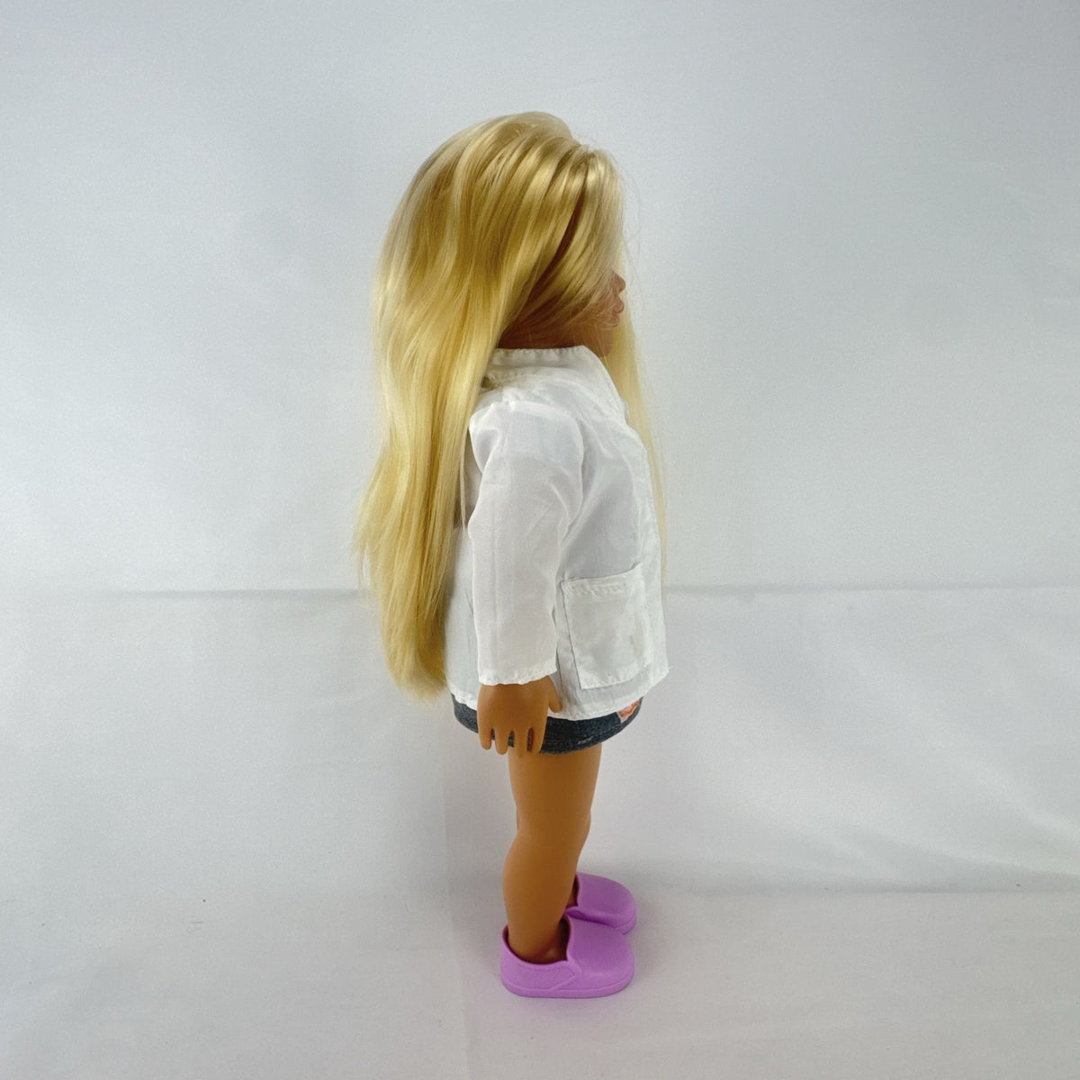 Our Generation Nicola 18-inch blonde veterinarian doll in white lab coat, patterned top, and purple shoes