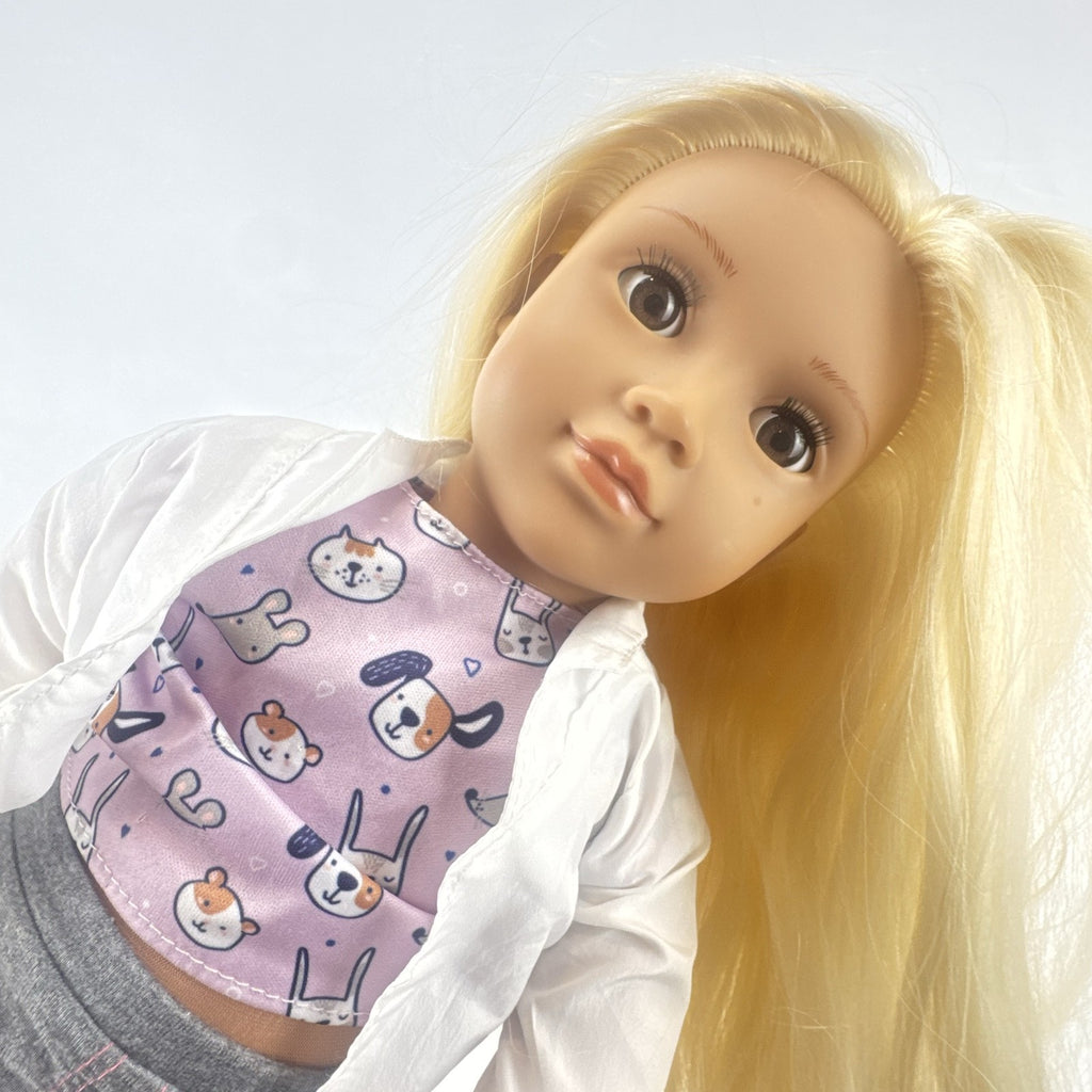 Our Generation Nicola 18-inch blonde veterinarian doll in white lab coat, patterned top, and purple shoes