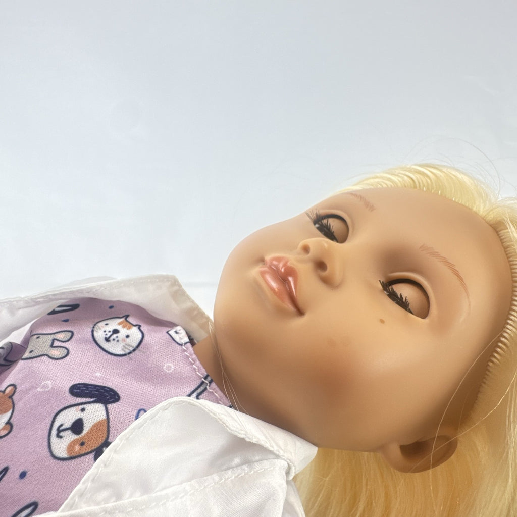Our Generation Nicola 18-inch blonde veterinarian doll in white lab coat, patterned top, and purple shoes