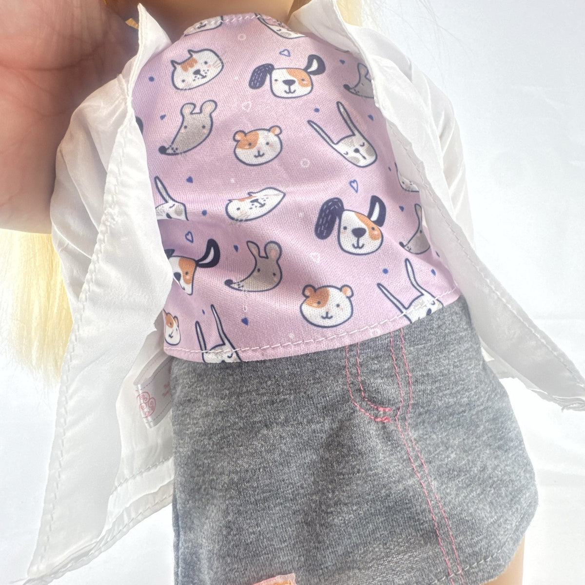 Our Generation Nicola 18-inch blonde veterinarian doll in white lab coat, patterned top, and purple shoes