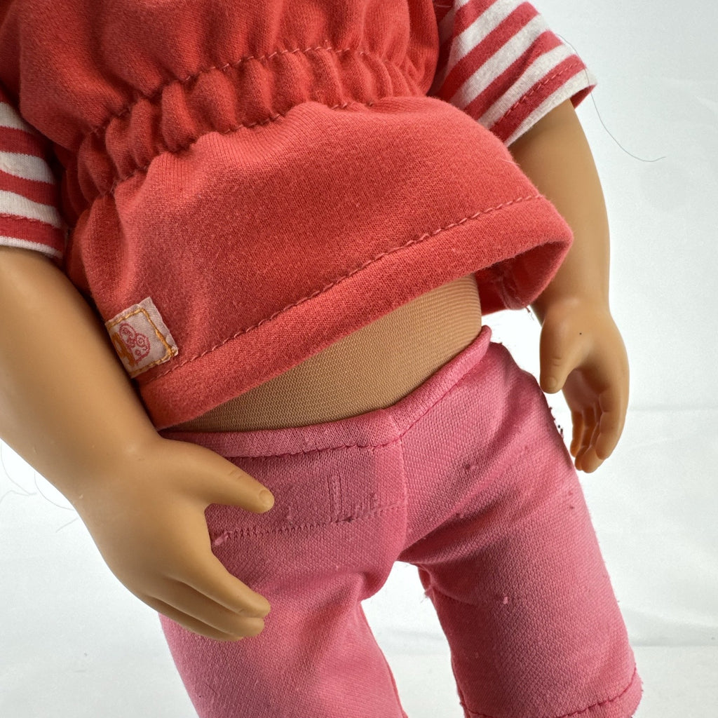 Battat Our Generation 18-inch doll with wavy brown hair, red striped shirt, and pink shorts
