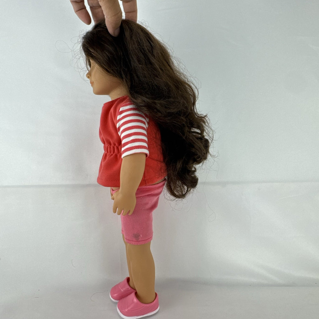 Battat Our Generation 18-inch doll with wavy brown hair, red striped shirt, and pink shorts