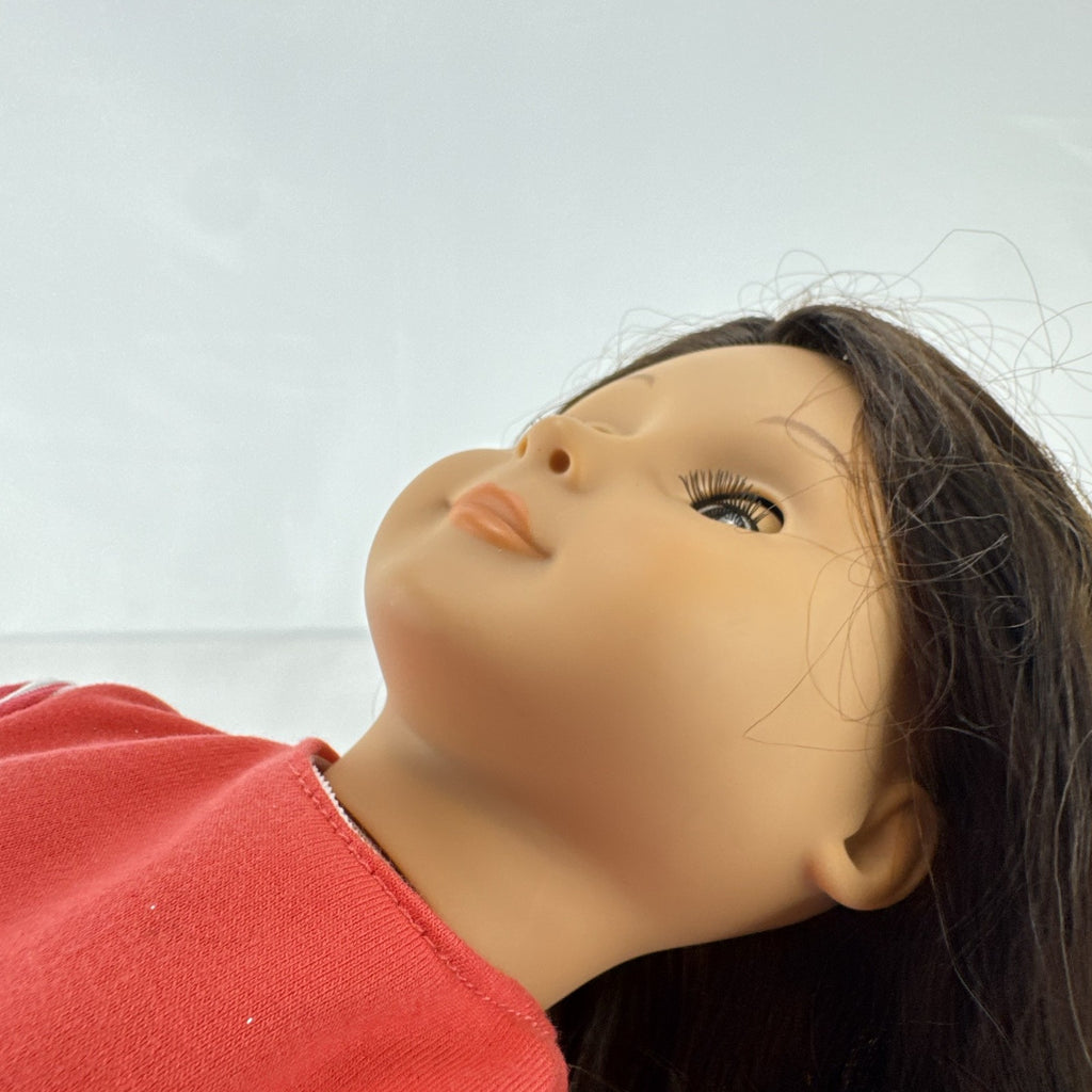 Battat Our Generation 18-inch doll with wavy brown hair, red striped shirt, and pink shorts
