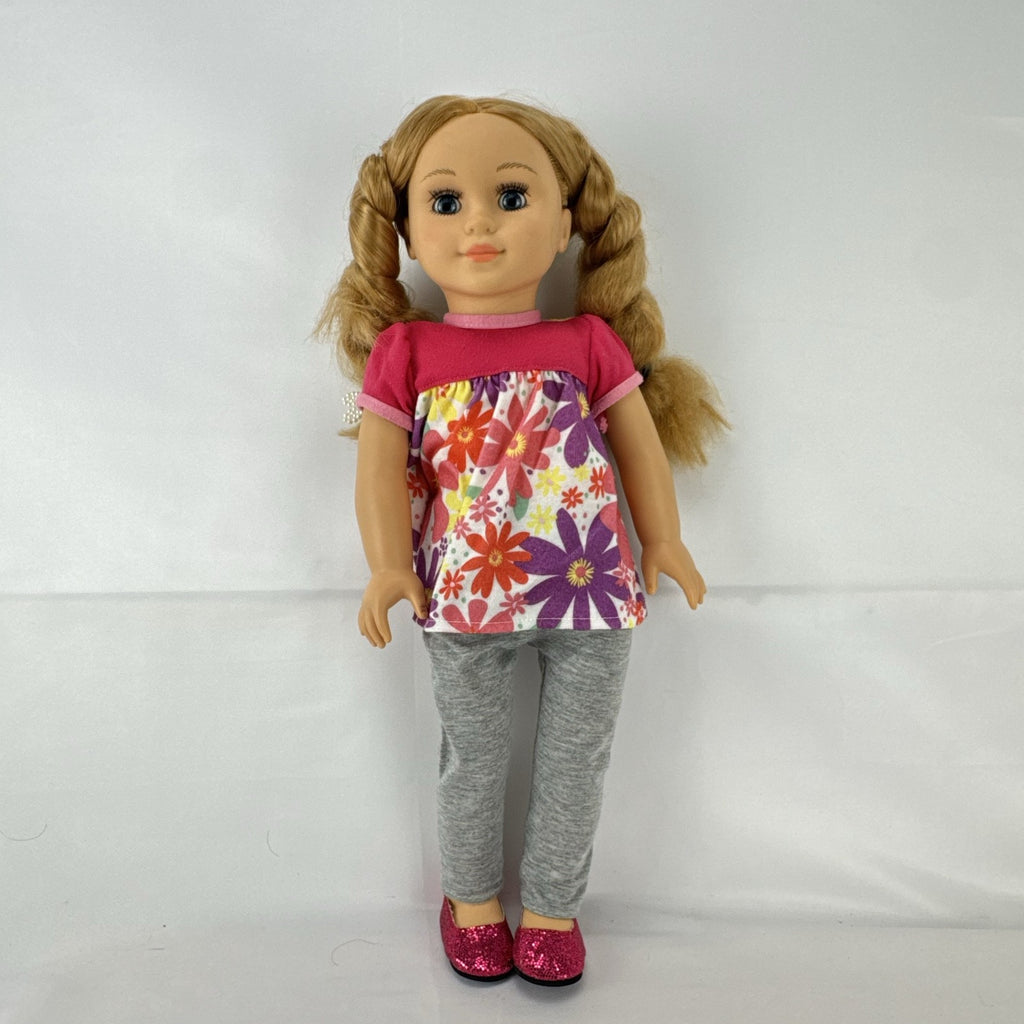 Lovee Doll & Toy Co. 18-inch girl doll with blonde braids, blue eyes, floral top, and pink glitter flats