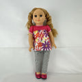 Lovee Doll & Toy Co. 18-inch girl doll with blonde braids, blue eyes, floral top, and pink glitter flats