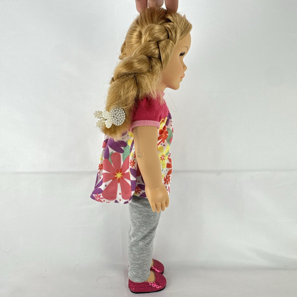 Lovee Doll & Toy Co. 18-inch girl doll with blonde braids, blue eyes, floral top, and pink glitter flats