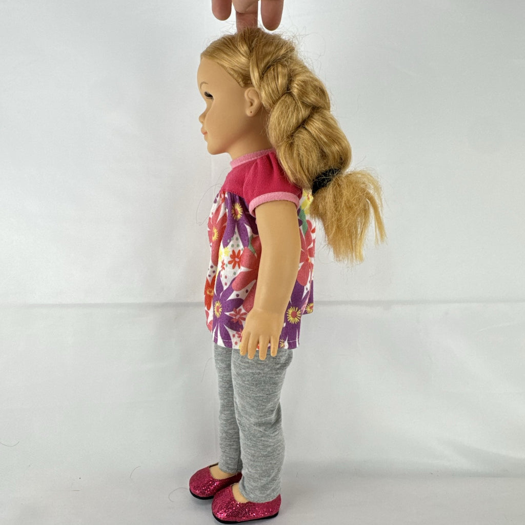 Lovee Doll & Toy Co. 18-inch girl doll with blonde braids, blue eyes, floral top, and pink glitter flats