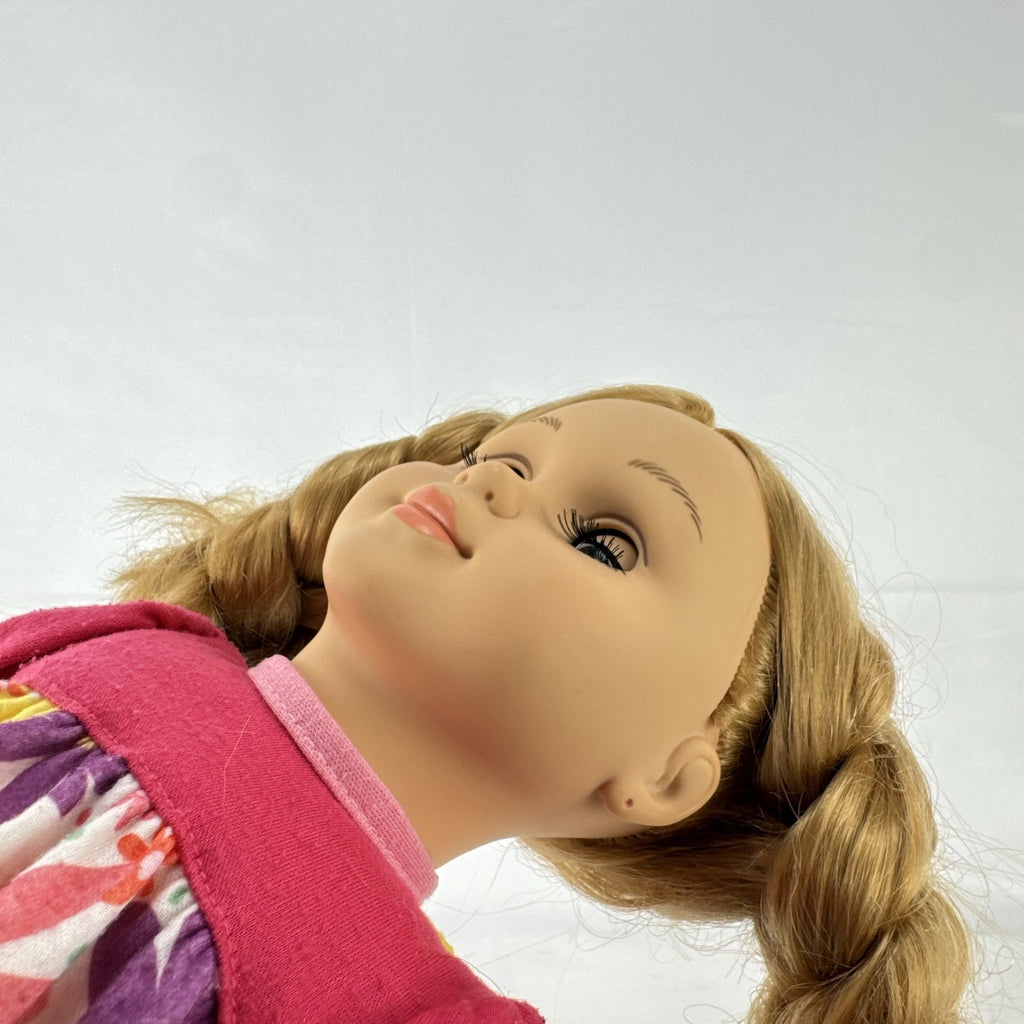 Lovee Doll & Toy Co. 18-inch girl doll with blonde braids, blue eyes, floral top, and pink glitter flats