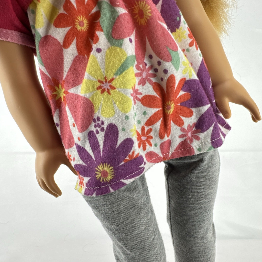 Lovee Doll & Toy Co. 18-inch girl doll with blonde braids, blue eyes, floral top, and pink glitter flats