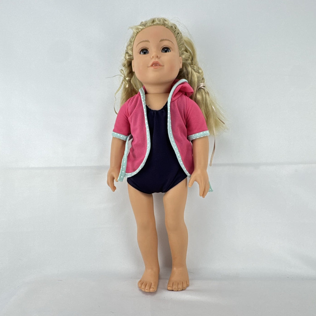 Adora 18-inch blonde doll with blue eyes wearing a navy swimsuit and pink polka dot hooded cover-up