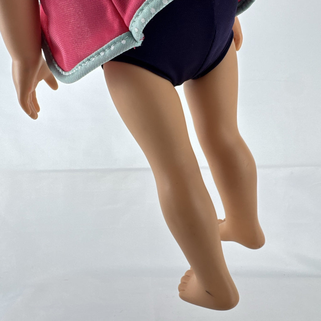 Adora 18-inch blonde doll with blue eyes wearing a navy swimsuit and pink polka dot hooded cover-up
