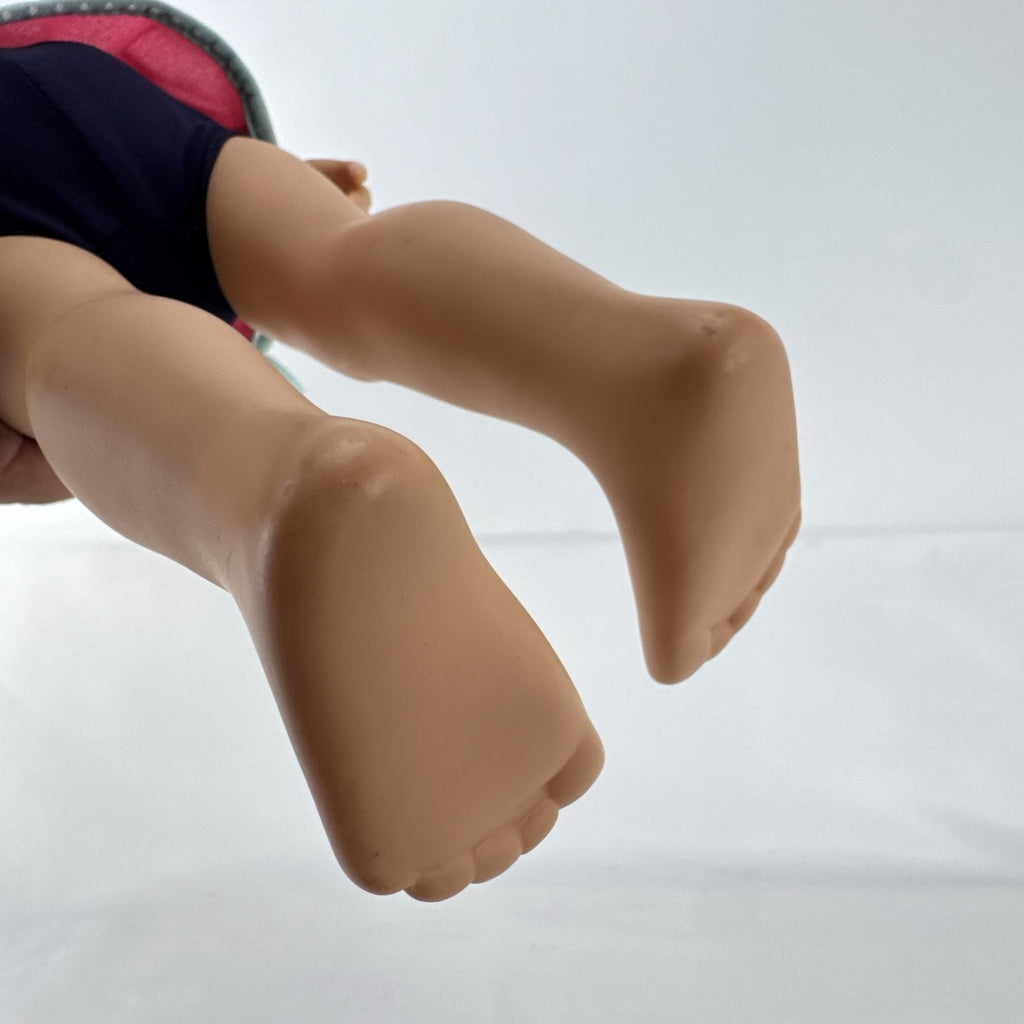 Adora 18-inch blonde doll with blue eyes wearing a navy swimsuit and pink polka dot hooded cover-up