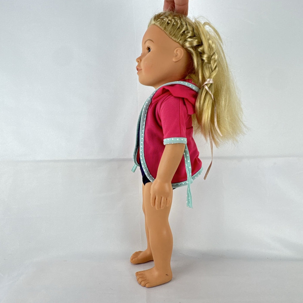 Adora 18-inch blonde doll with blue eyes wearing a navy swimsuit and pink polka dot hooded cover-up