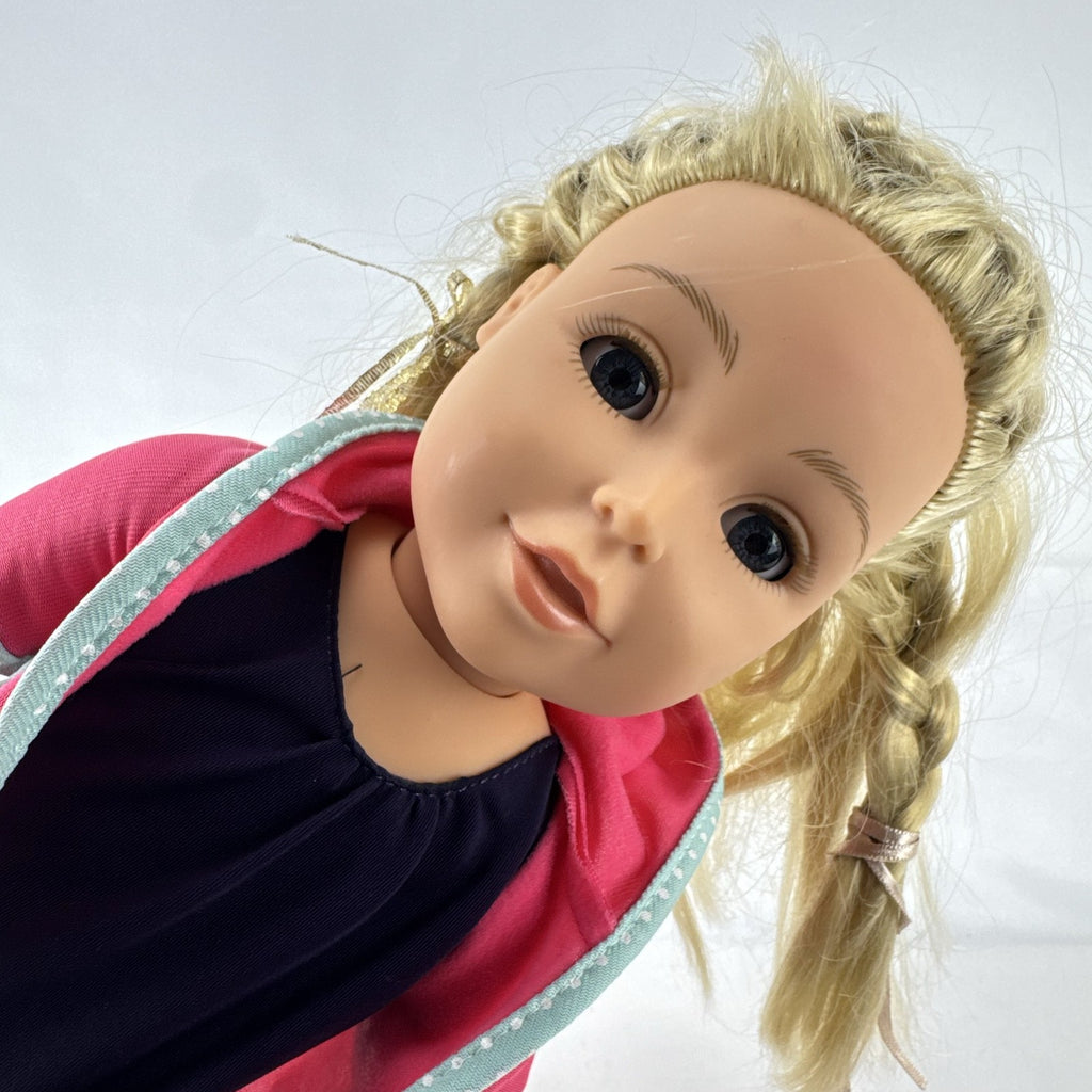 Adora 18-inch blonde doll with blue eyes wearing a navy swimsuit and pink polka dot hooded cover-up