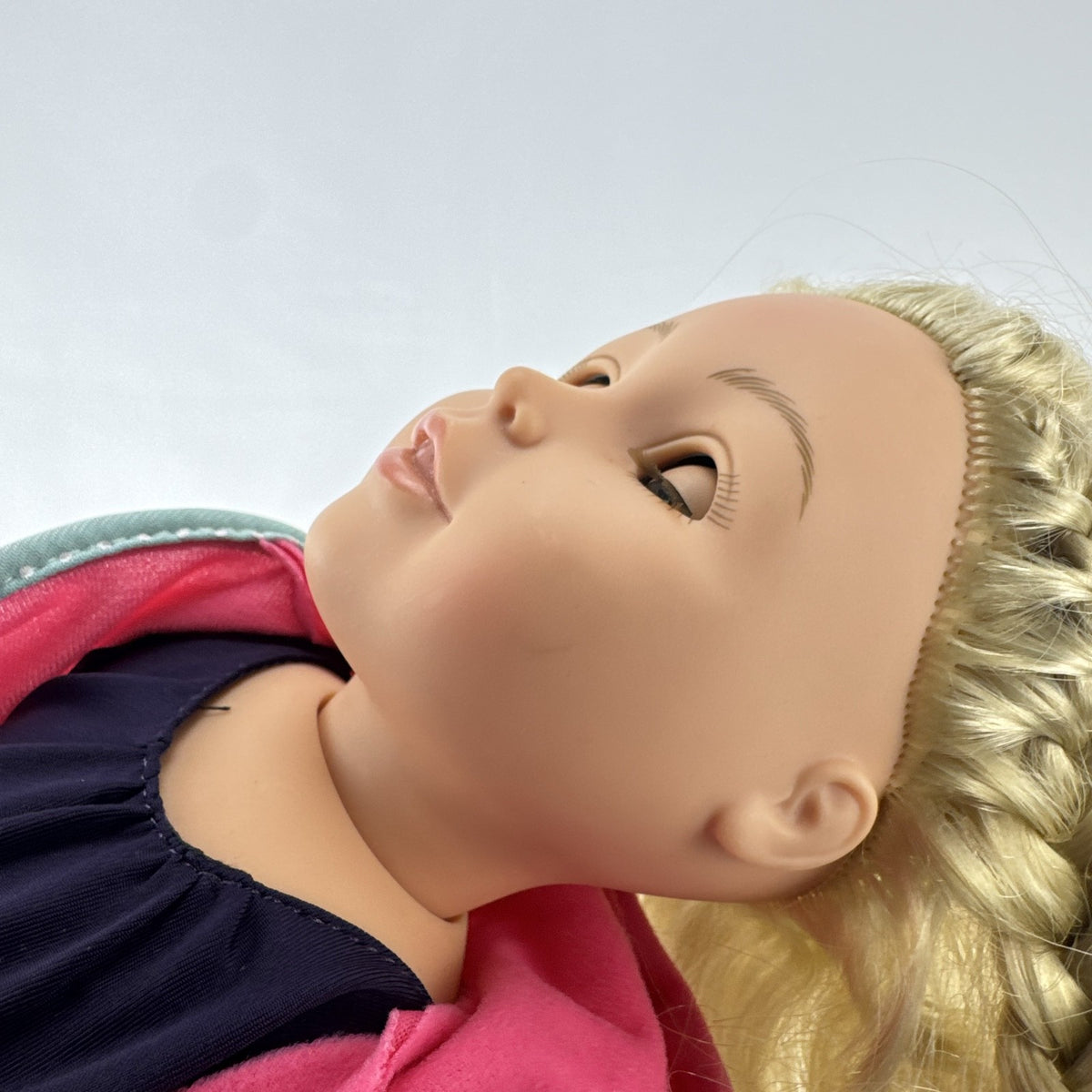 Adora 18-inch blonde doll with blue eyes wearing a navy swimsuit and pink polka dot hooded cover-up