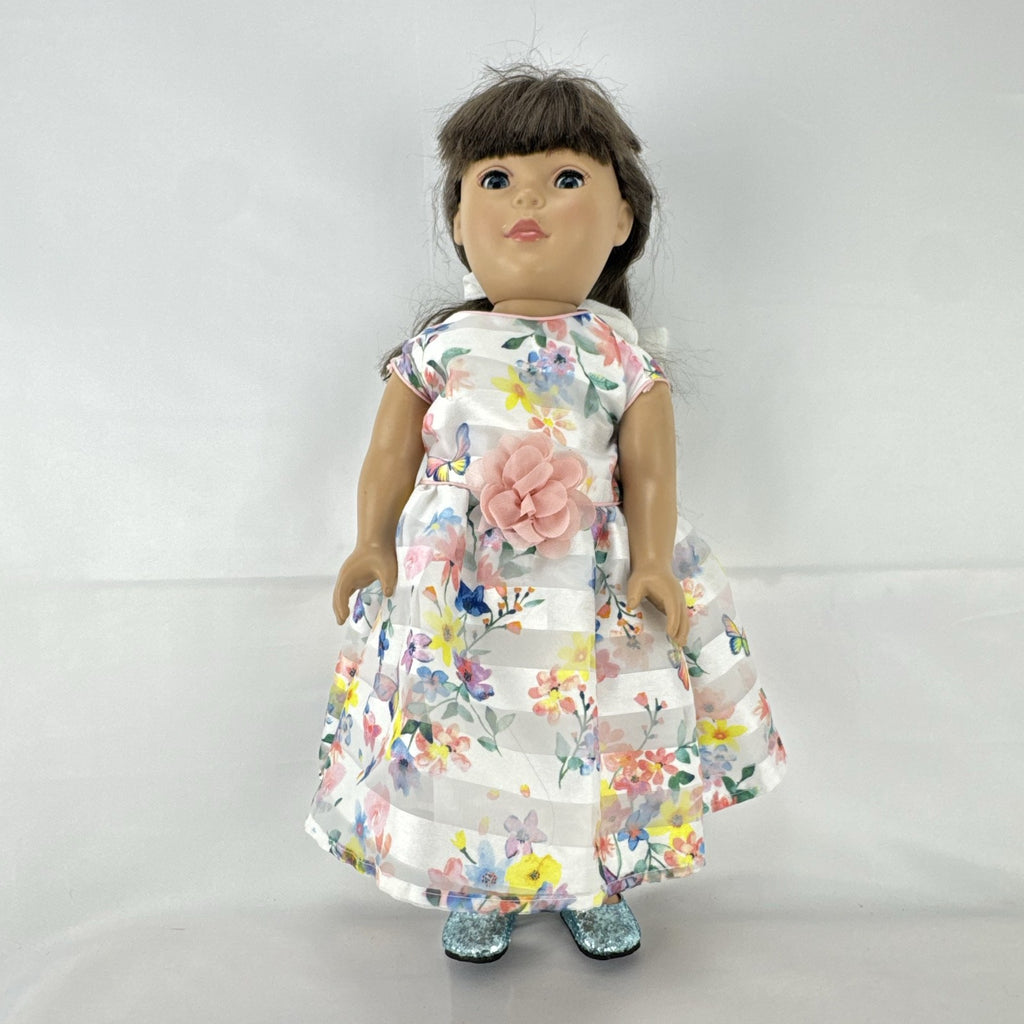 Madame Alexander 18-inch vinyl girl doll with brown ponytail, blue eyes, butterfly floral dress, and glitter shoes