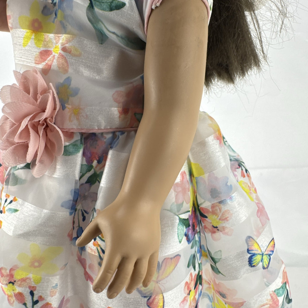 Madame Alexander 18-inch vinyl girl doll with brown ponytail, blue eyes, butterfly floral dress, and glitter shoes
