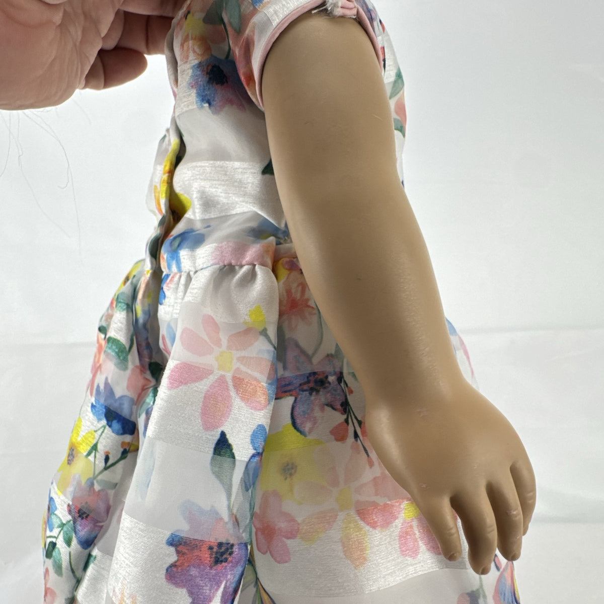 Madame Alexander 18-inch vinyl girl doll with brown ponytail, blue eyes, butterfly floral dress, and glitter shoes