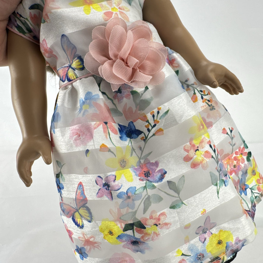 Madame Alexander 18-inch vinyl girl doll with brown ponytail, blue eyes, butterfly floral dress, and glitter shoes