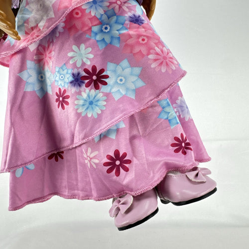 Battat Our Generation 18-inch girl doll with wavy brown hair wearing a pink floral tiered dress and bow shoes