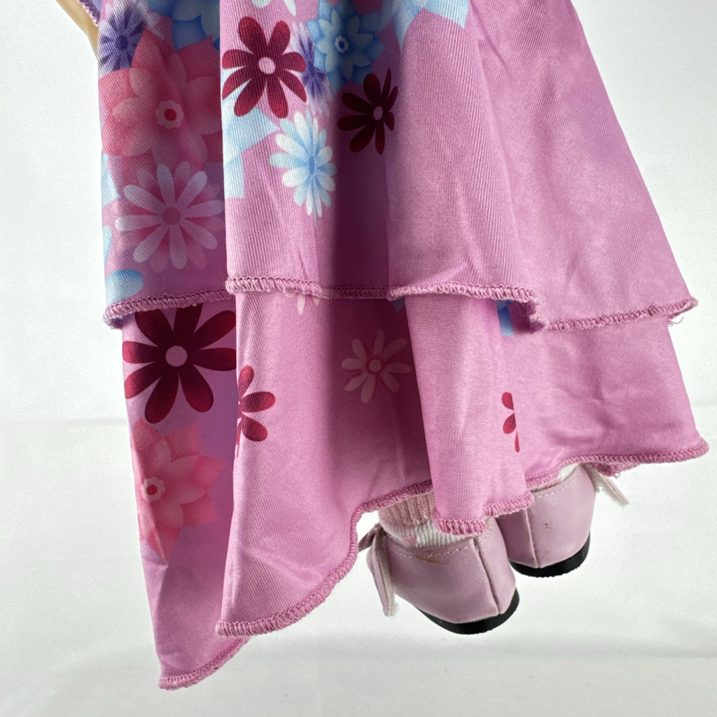 Battat Our Generation 18-inch girl doll with wavy brown hair wearing a pink floral tiered dress and bow shoes