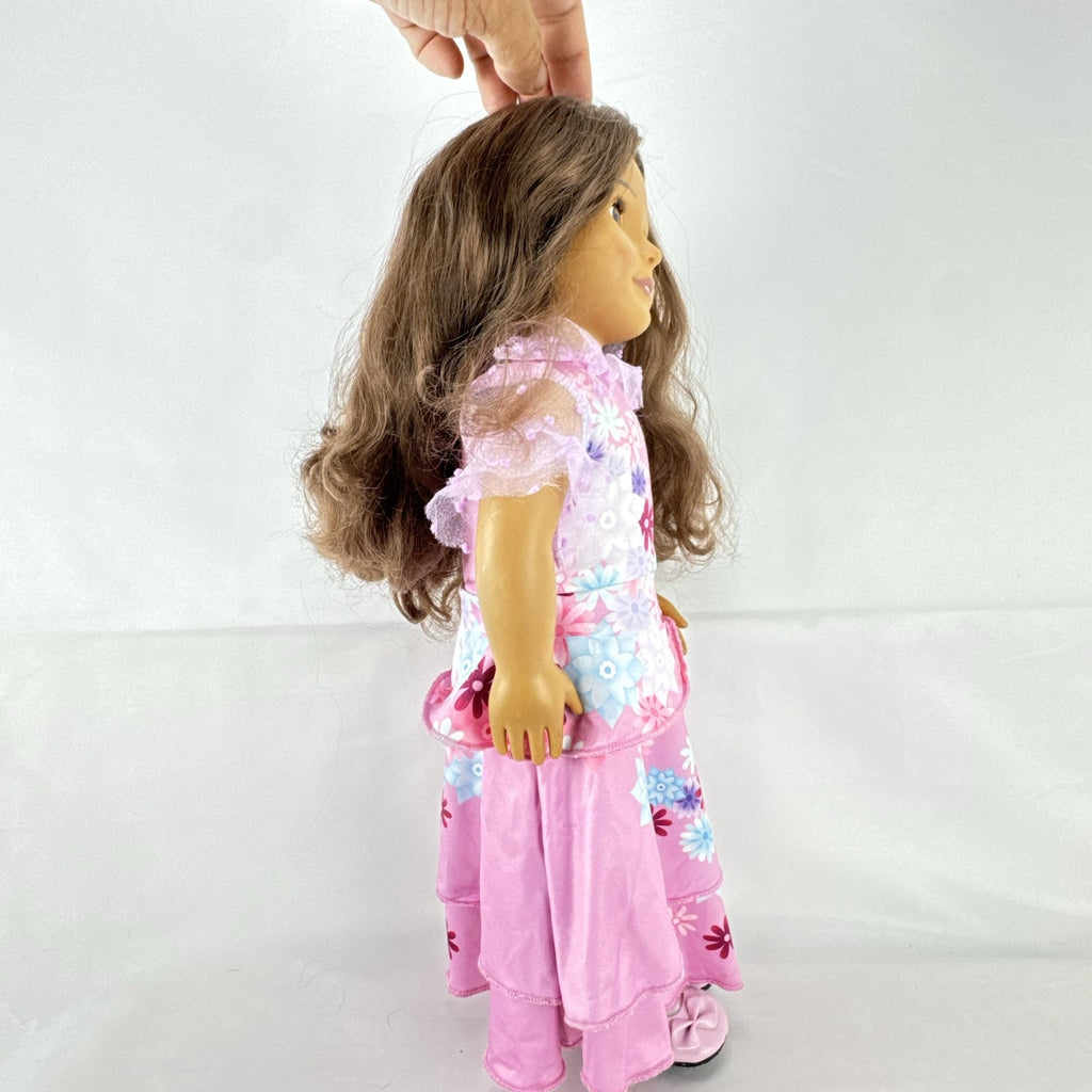 Battat Our Generation 18-inch girl doll with wavy brown hair wearing a pink floral tiered dress and bow shoes