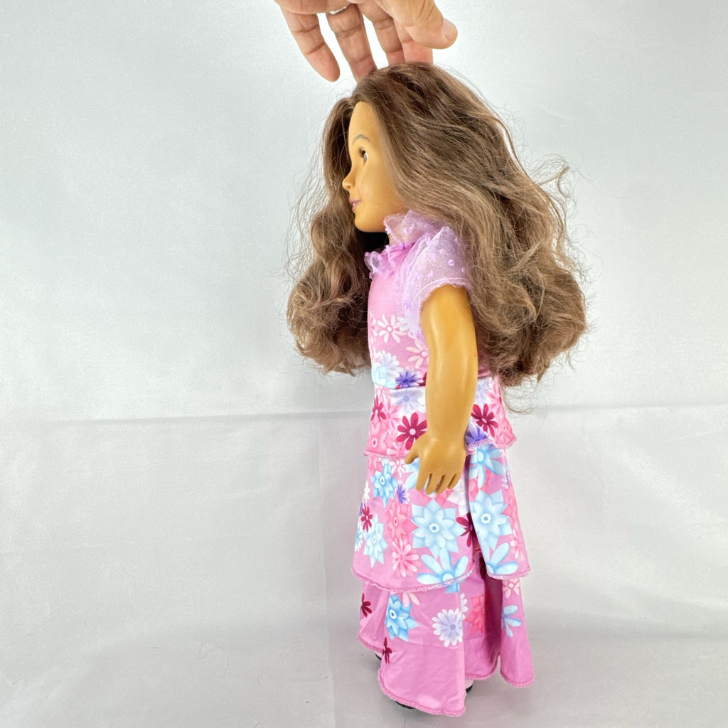 Battat Our Generation 18-inch girl doll with wavy brown hair wearing a pink floral tiered dress and bow shoes