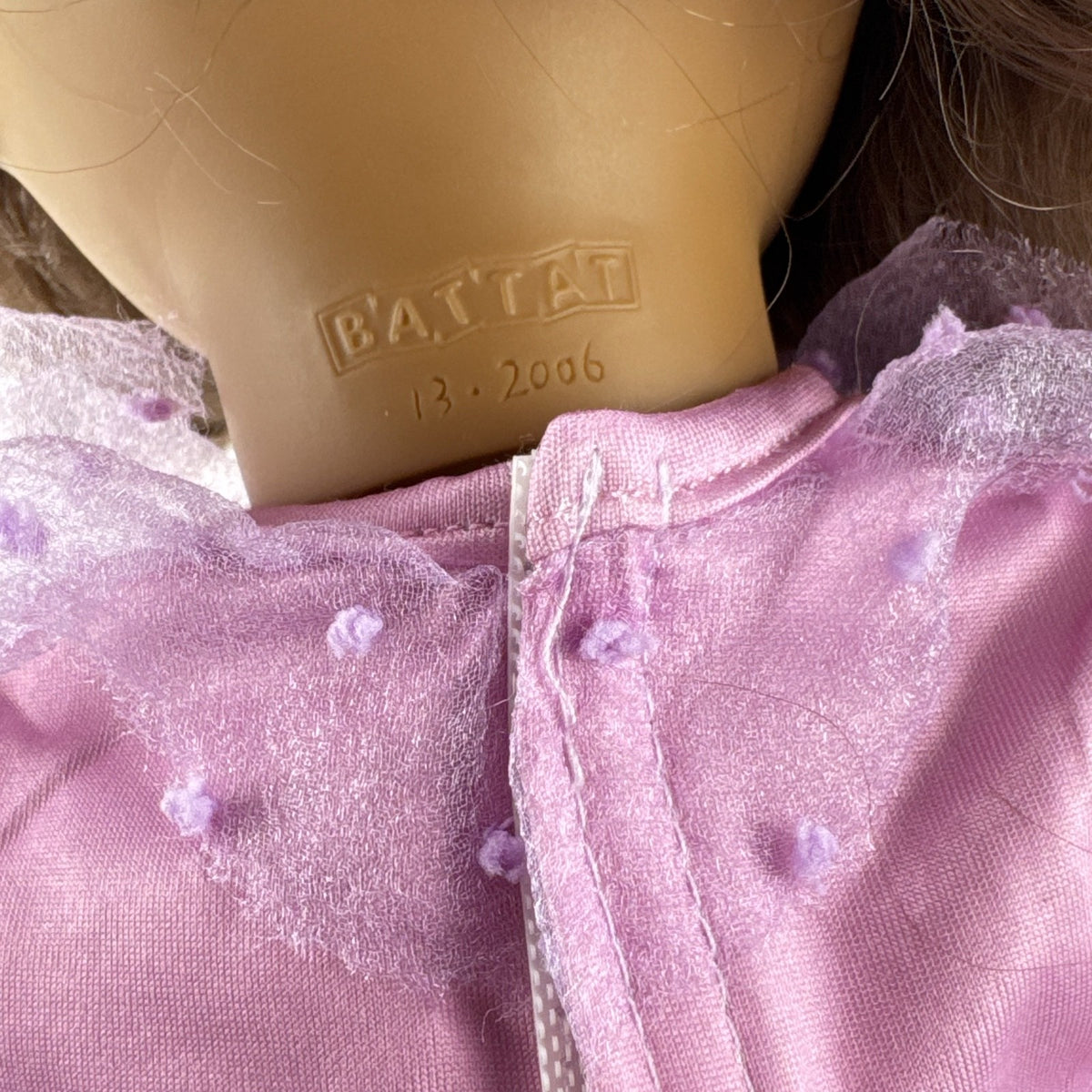 Battat Our Generation 18-inch girl doll with wavy brown hair wearing a pink floral tiered dress and bow shoes