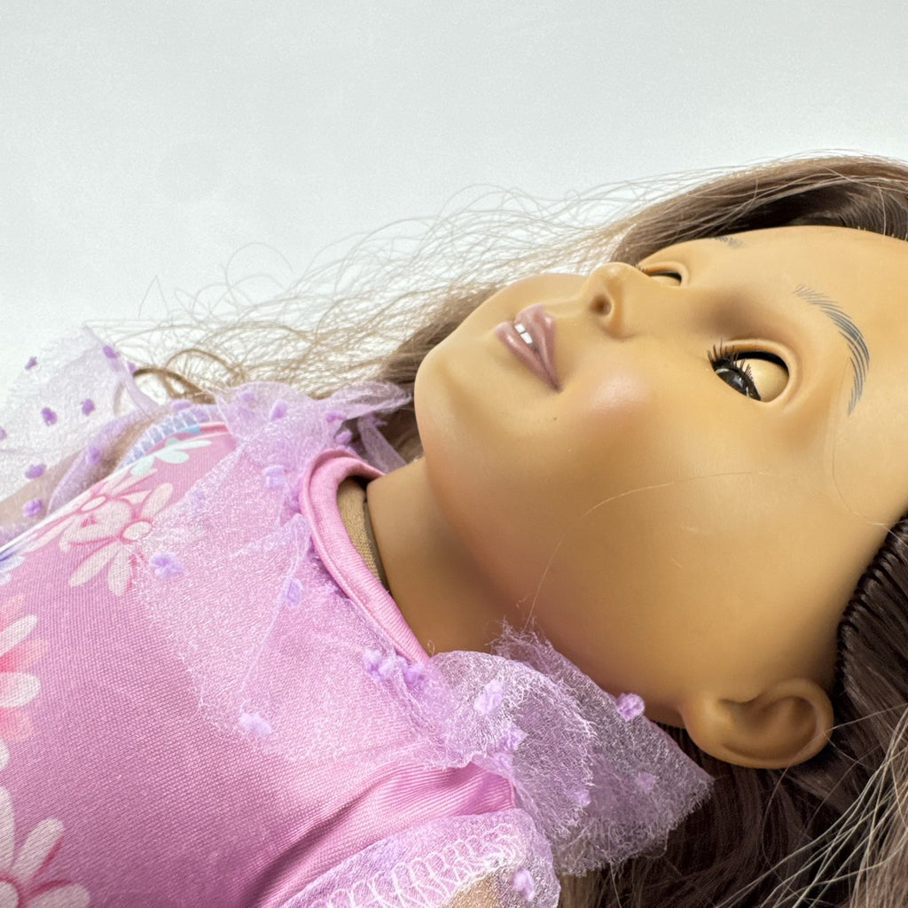 Battat Our Generation 18-inch girl doll with wavy brown hair wearing a pink floral tiered dress and bow shoes