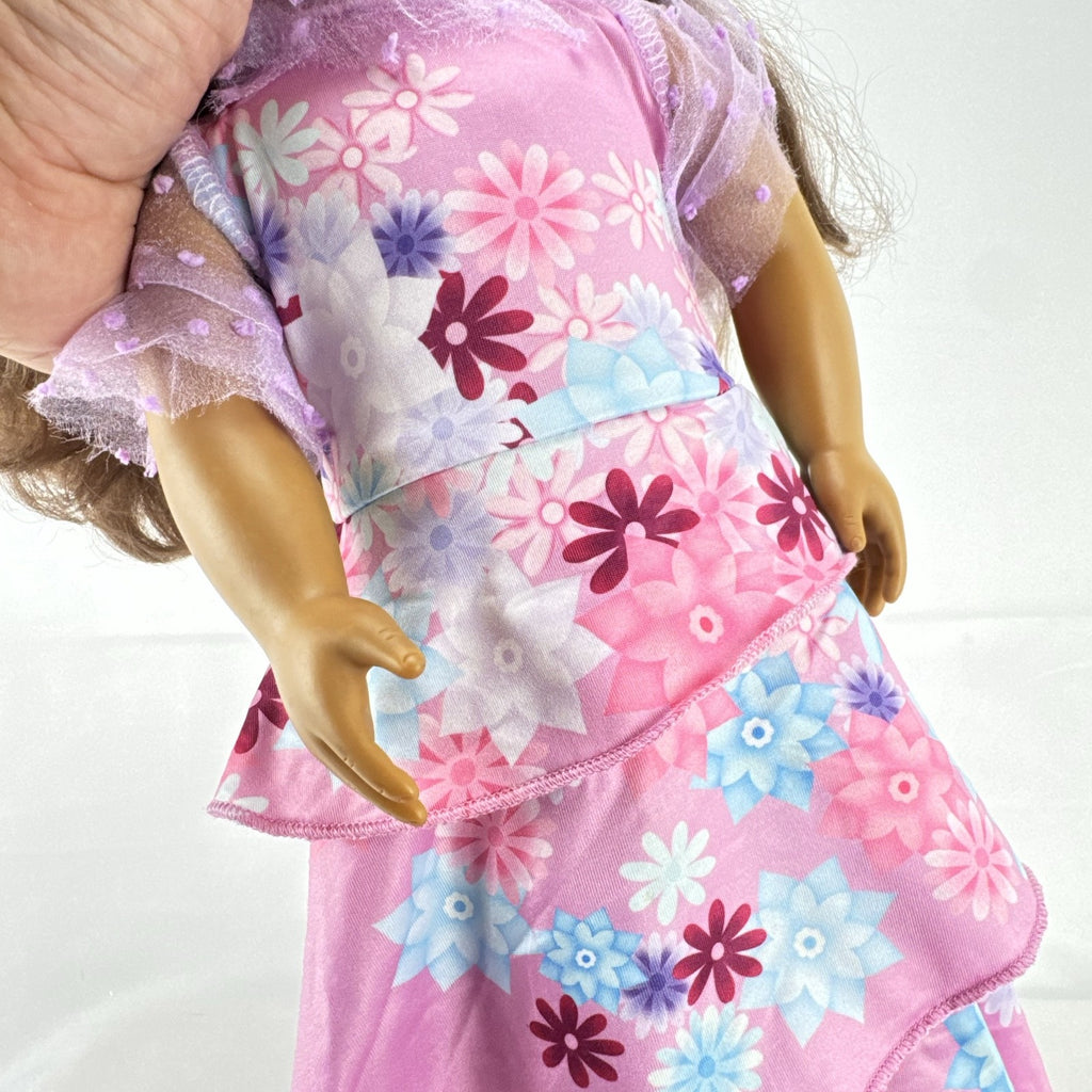 Battat Our Generation 18-inch girl doll with wavy brown hair wearing a pink floral tiered dress and bow shoes