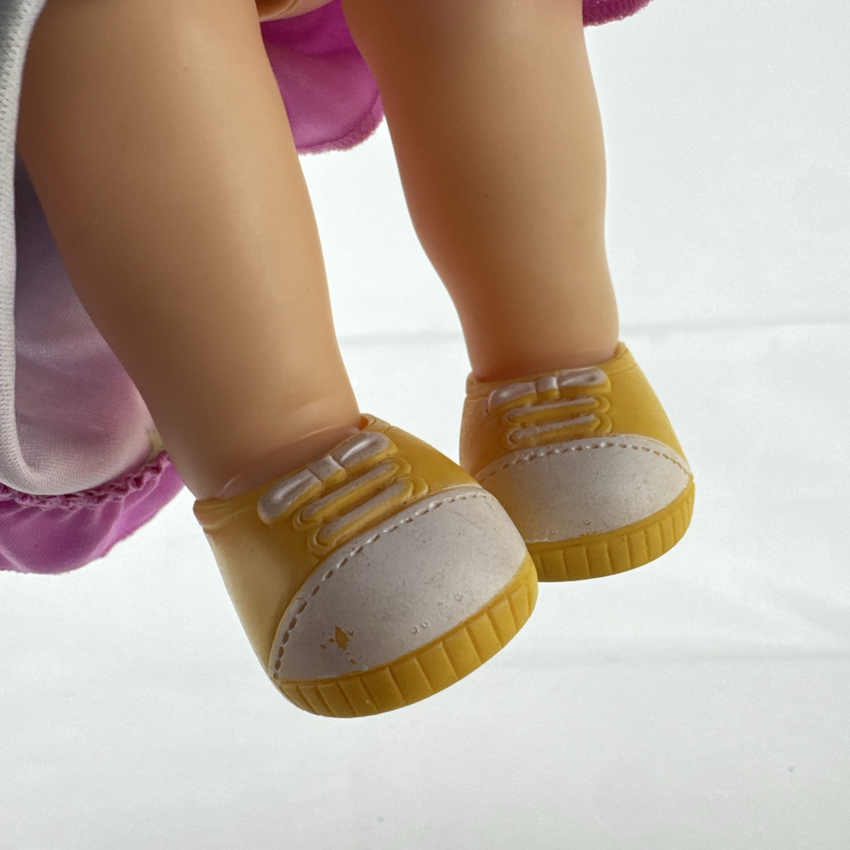 Hasbro Baby Alive 12-inch doll with black pigtails wearing a colorful Disney Vampirina dress