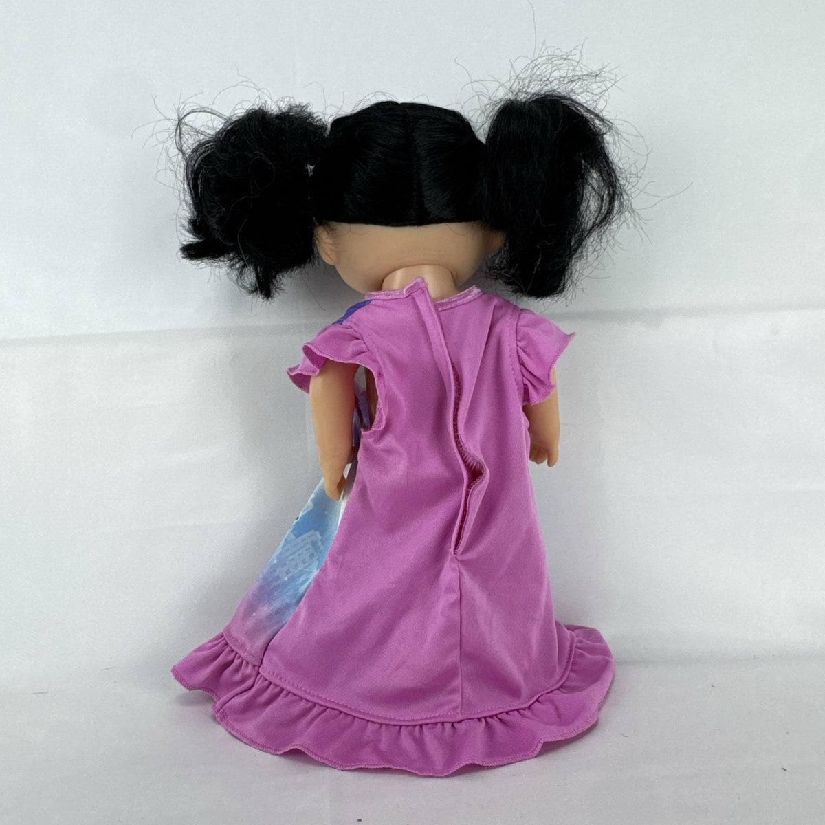 Hasbro Baby Alive 12-inch doll with black pigtails wearing a colorful Disney Vampirina dress
