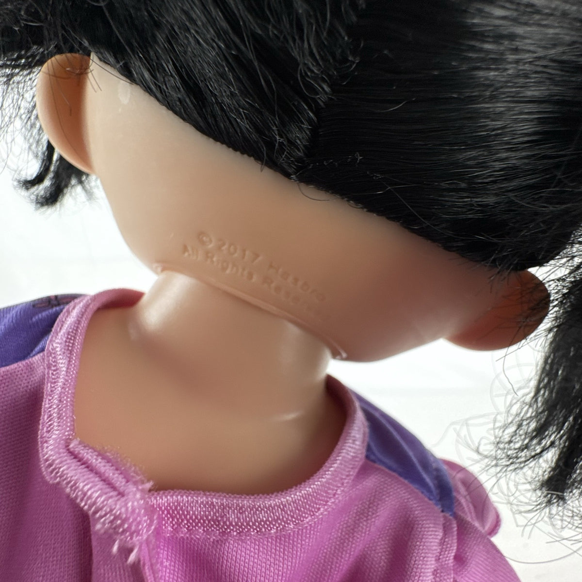 Hasbro Baby Alive 12-inch doll with black pigtails wearing a colorful Disney Vampirina dress