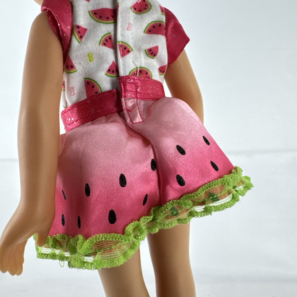 Mattel Barbie 14-inch blonde toddler play doll wearing a watermelon dress with green trim