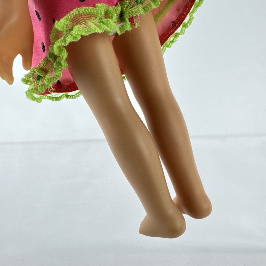 Mattel Barbie 14-inch blonde toddler play doll wearing a watermelon dress with green trim