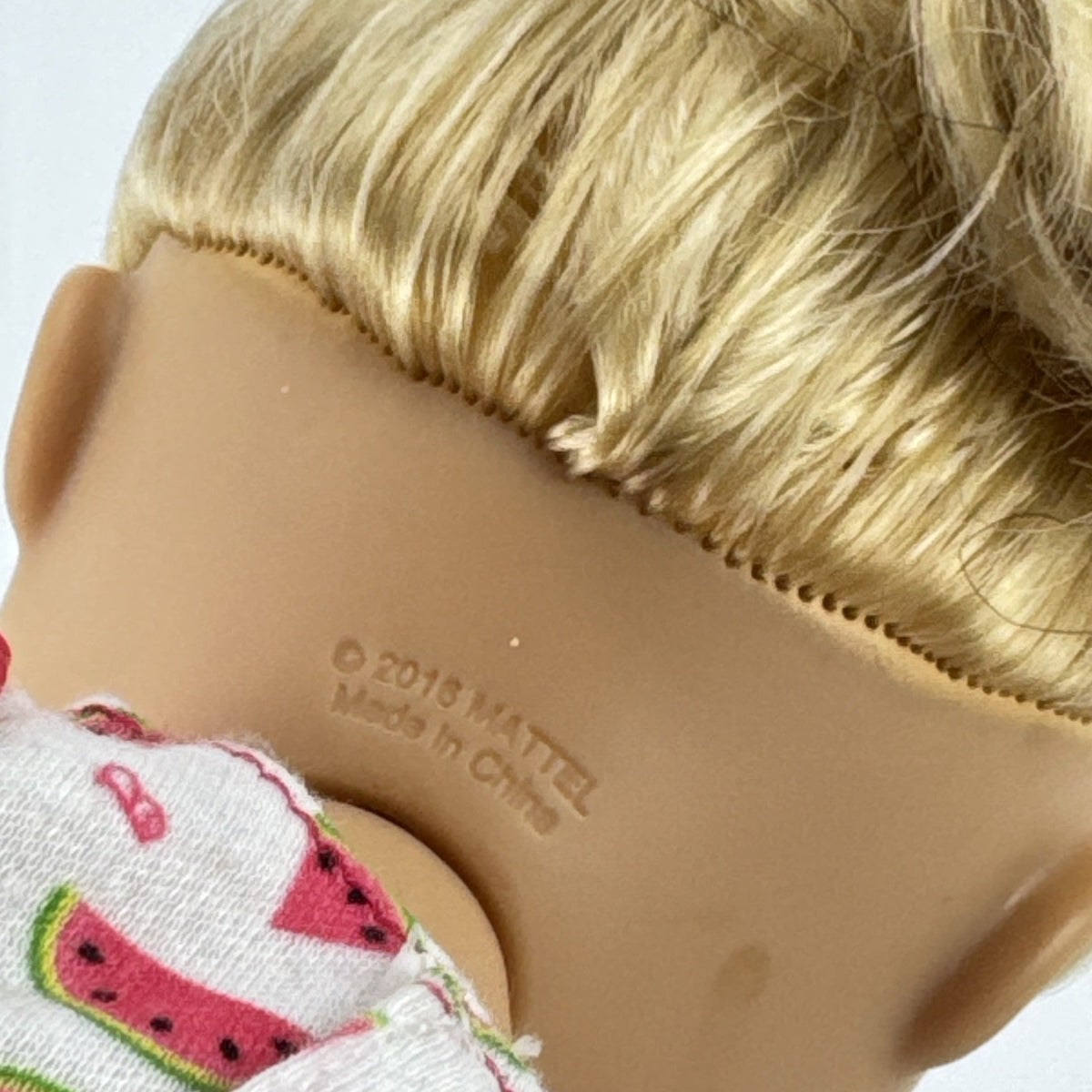 Mattel Barbie 14-inch blonde toddler play doll wearing a watermelon dress with green trim