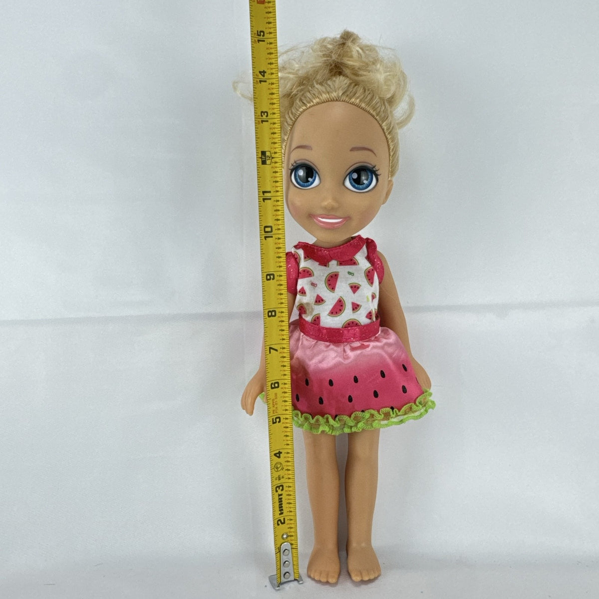 Mattel Barbie 14-inch blonde toddler play doll wearing a watermelon dress with green trim