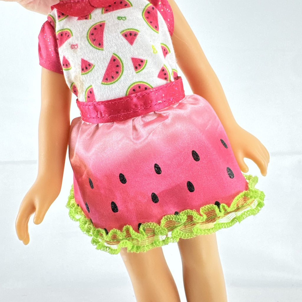 Mattel Barbie 14-inch blonde toddler play doll wearing a watermelon dress with green trim