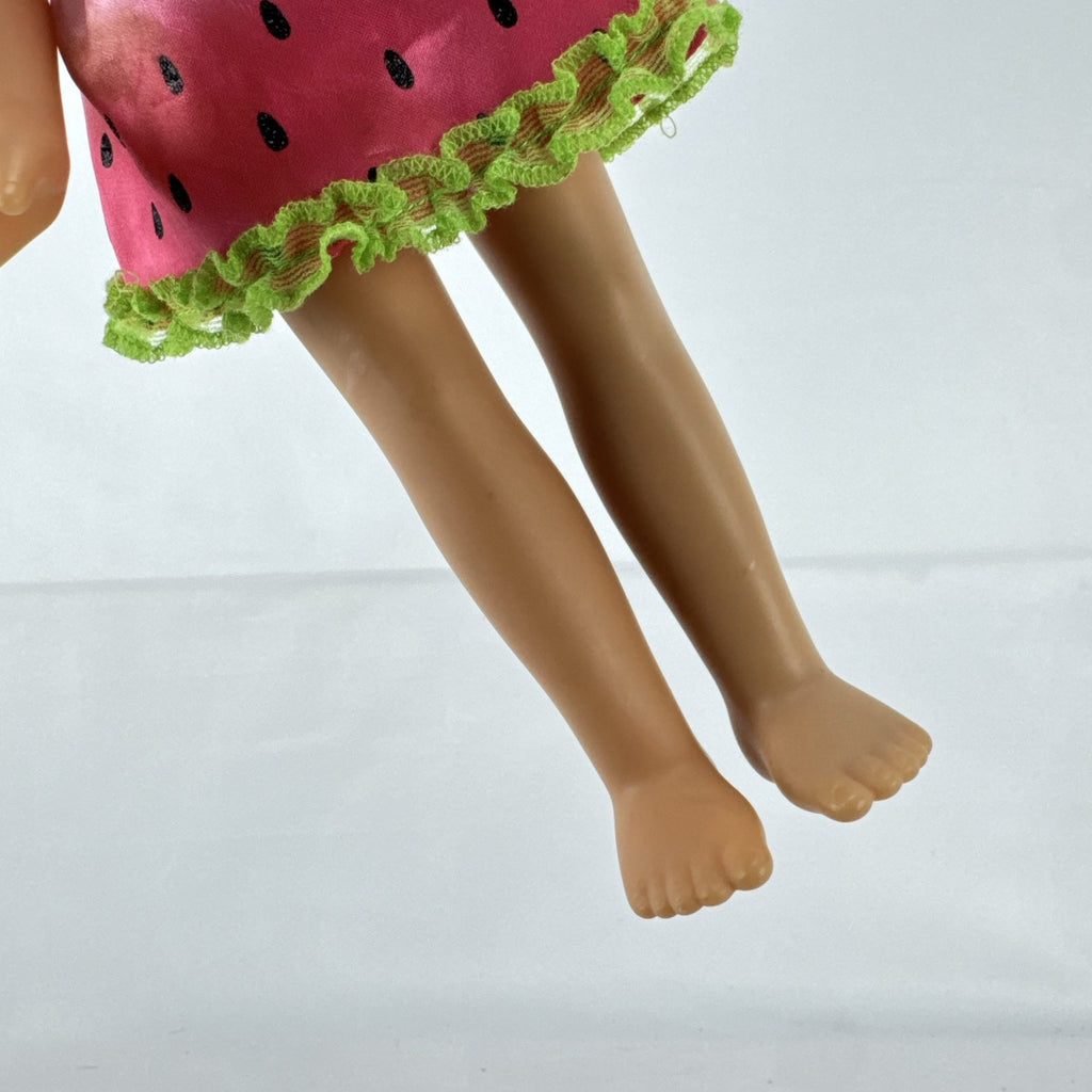 Mattel Barbie 14-inch blonde toddler play doll wearing a watermelon dress with green trim