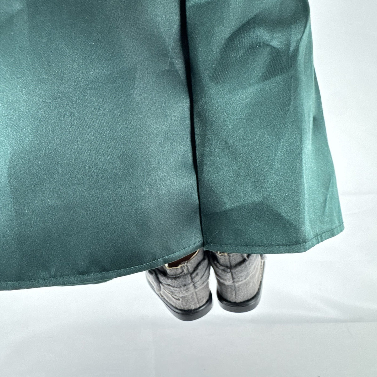 Battat Our Generation 18-inch blonde play doll wearing a green coronation dress and grey shoes