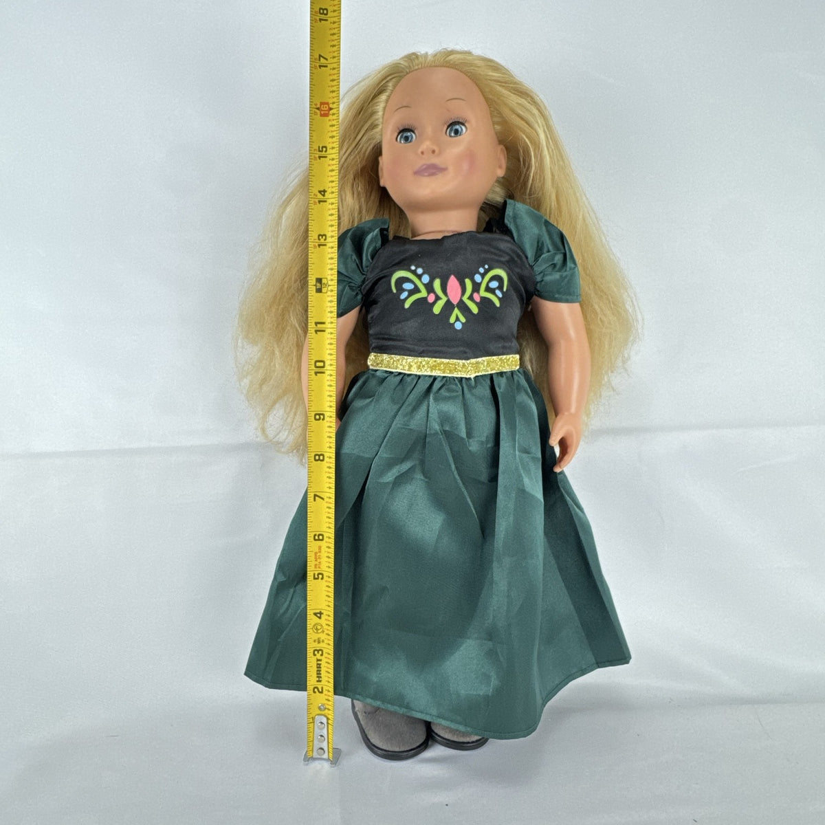 Battat Our Generation 18-inch blonde play doll wearing a green coronation dress and grey shoes