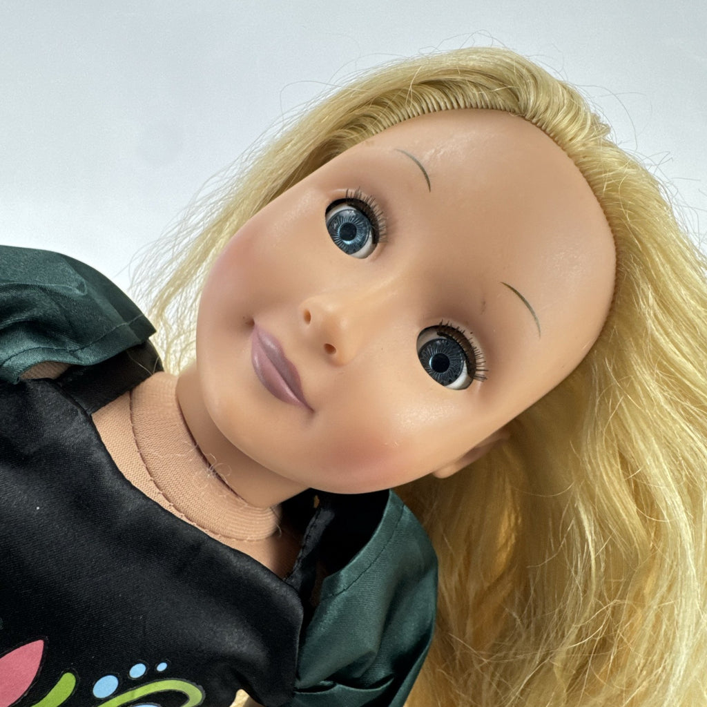 Battat Our Generation 18-inch blonde play doll wearing a green coronation dress and grey shoes